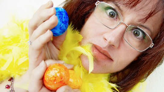 I Think, Therefore I Am ... So What Are You Thinking? image of woman holding up two colored eggs... with a surprised look on her face