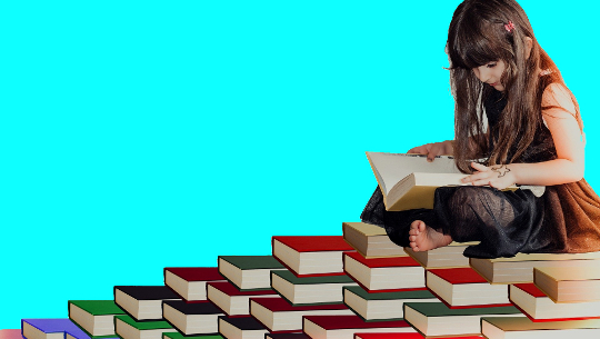 How to Recognize Attention Deficit Hyperactivity Disorder (ADHD) Young girl sitting surrounded by lots of book of various colors