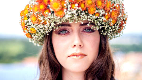 Hold That Unwavering Gaze! woman wearing a crown of flowers staring with an unwavering gaze