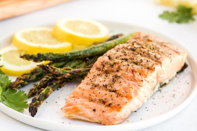 Omega-3 and Cancer Risk: What New Research Reveals A visual representation of omega-3 and omega-6 sources, featuring salmon, walnuts, flaxseeds, and vegetable oil against a neutral background.